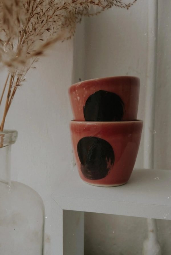 black dot on pink